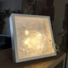 Lumina 3D resin sculpture by Mirjana Fat in a minimalist white frame with integrated light.
